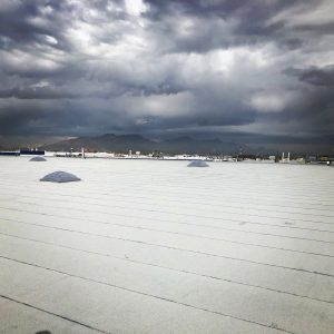 non-waterproofed roof under rain clouds